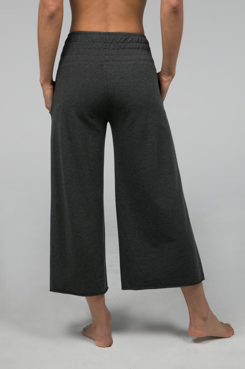 Back view of the KiraGrace Cozy Boho Crop Yoga Pant in charcoal heather, showcasing the relaxed fit and flattering cropped design.