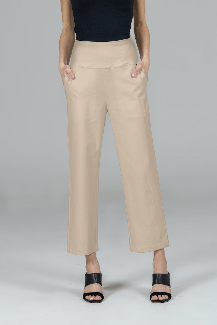 Model wearing khaki high waist ankle pants, showcasing a tailored fit with a clean front, side pockets, and a comfortable high-rise waistband. The pants have a cropped length, ending just above the ankles, perfect for a polished yet casual look.