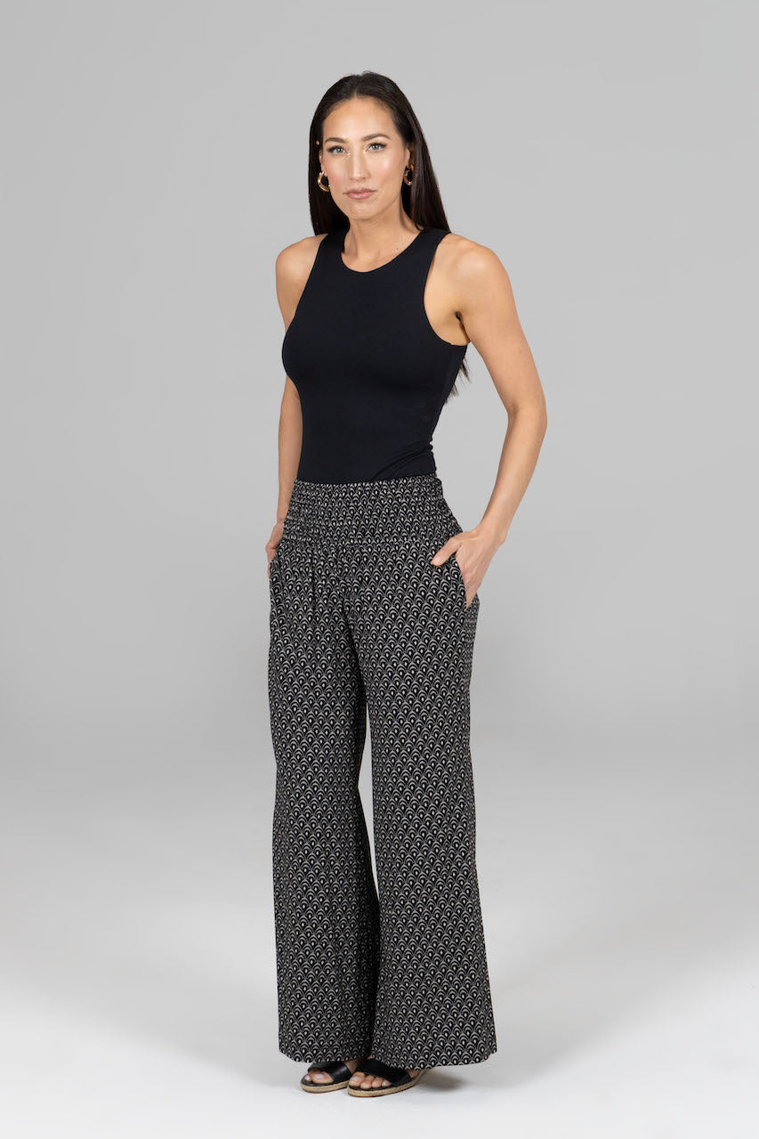 Full outfit featuring the Portofino Travel Pant in woodblock print, styled with a complementary top to showcase a chic and relaxed look perfect for travel or casual outings