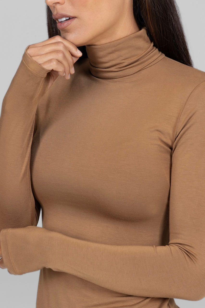 Close-up of the turtleneck collar on the camel Grace Turtleneck, emphasizing its classic design.