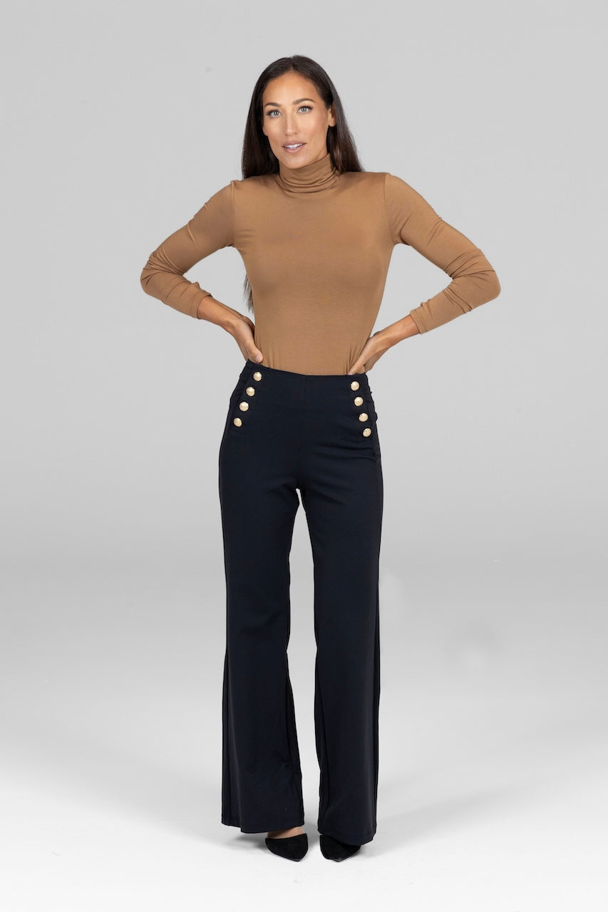 Model in camel Grace Turtleneck, styled with wide-leg pants for a sophisticated, relaxed look.