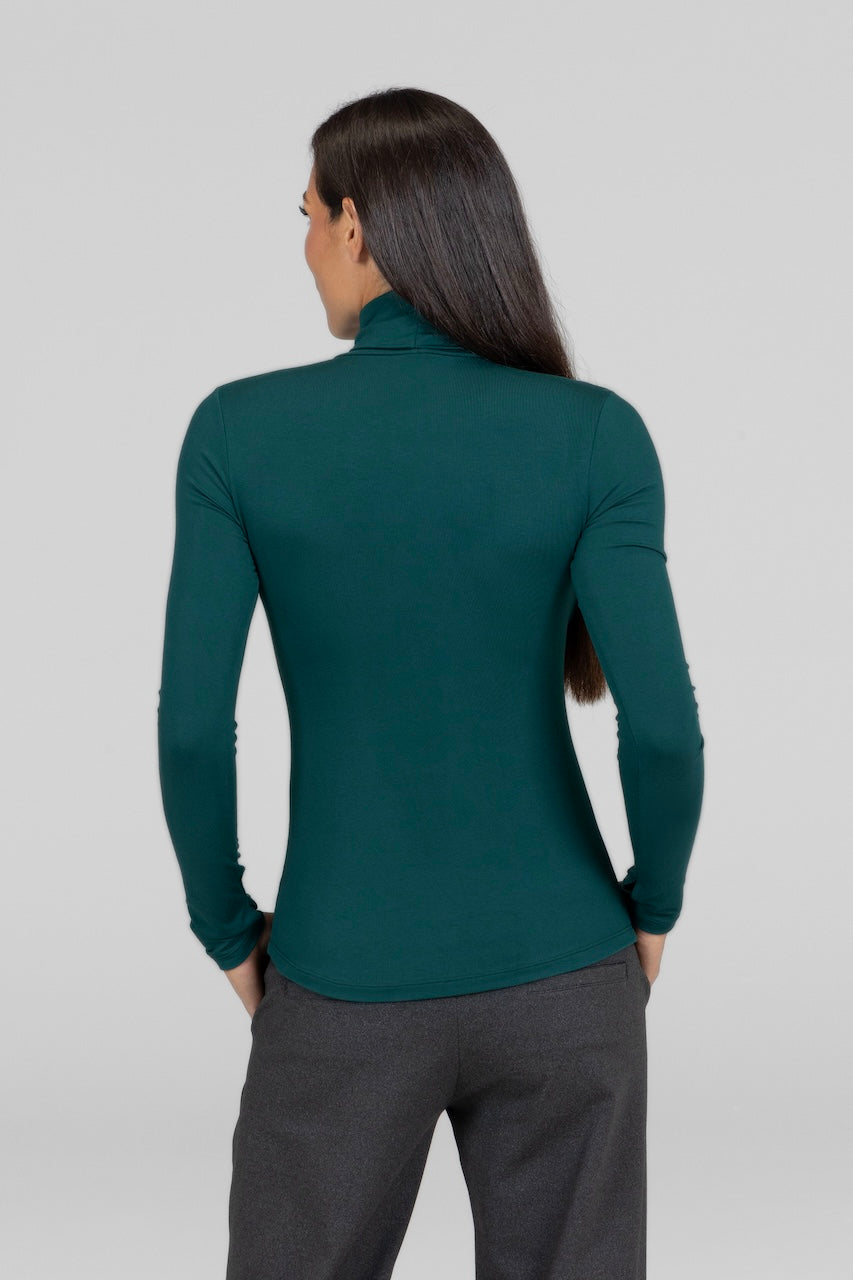 Back view of emerald Grace Turtleneck, showcasing the smooth, clean lines and elegant fit.