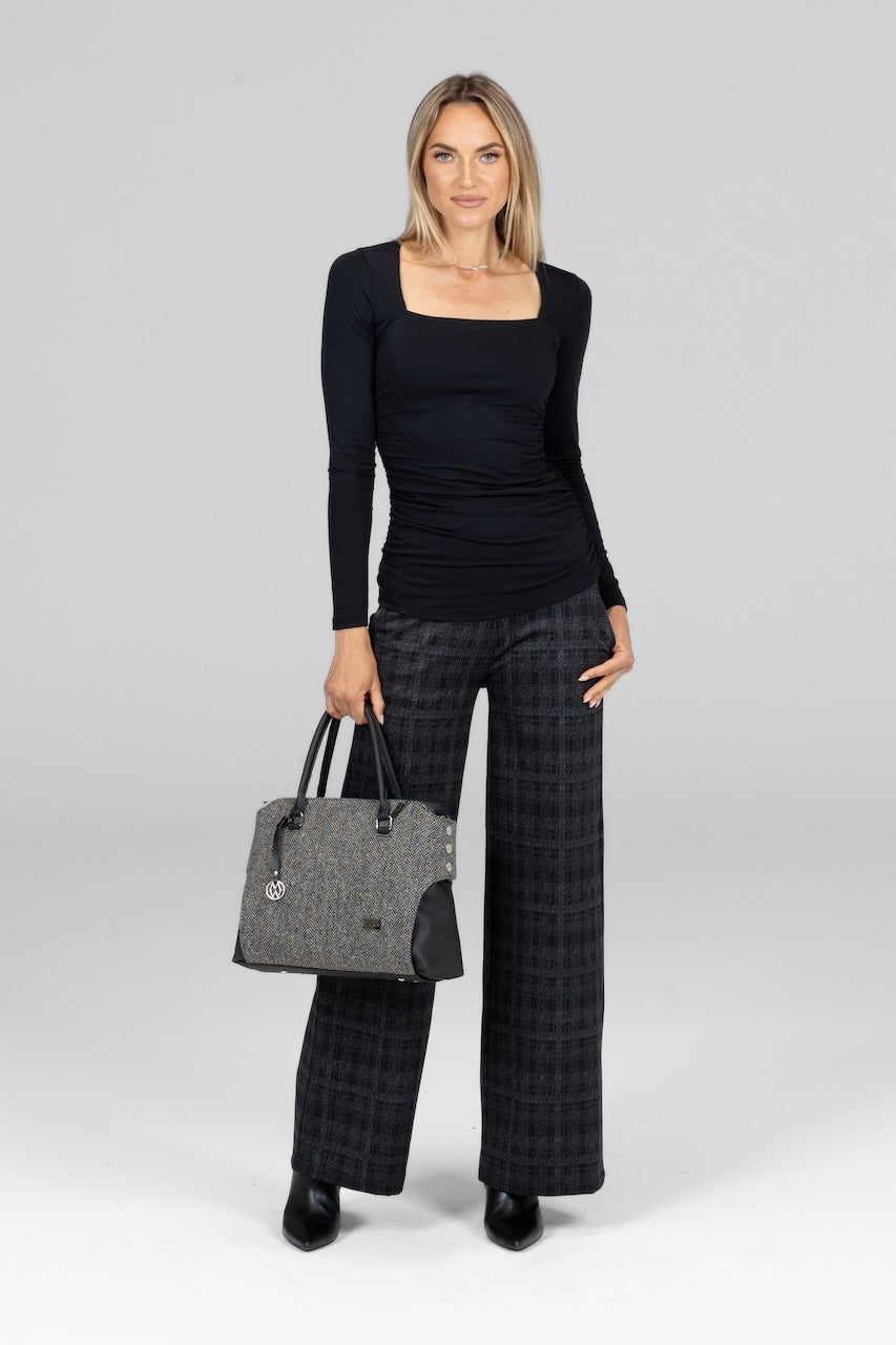 Model in black Square Neck Long Sleeve Top, paired with tailored wide-leg pants for an elegant, balanced look.