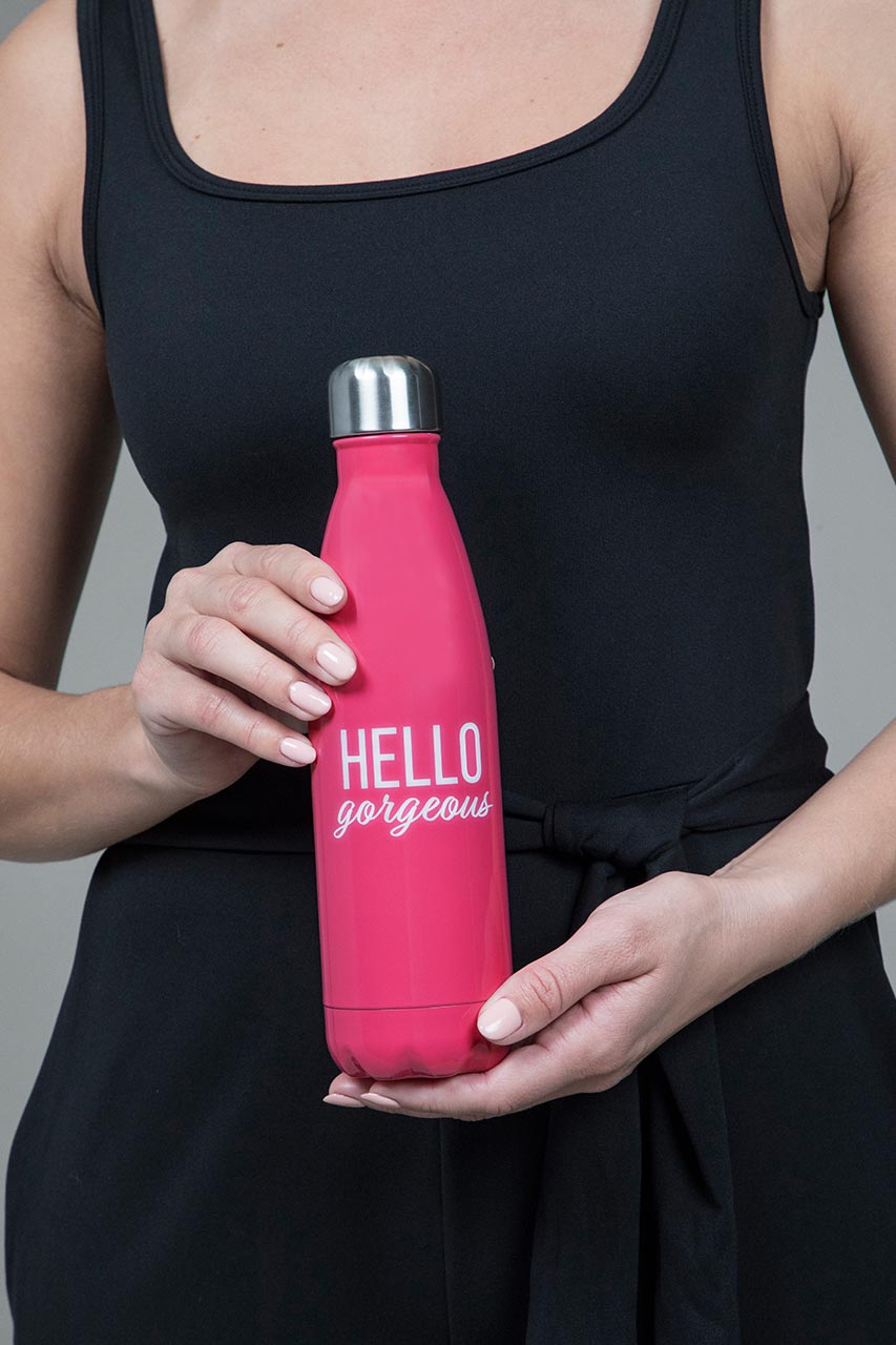 Close up of pink waterbottle with hello gorgeous on the front 